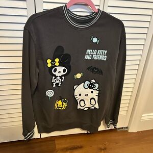 Hello Kitty and Friends Halloween Graphic Sweatshirt- graphic on front and back.
